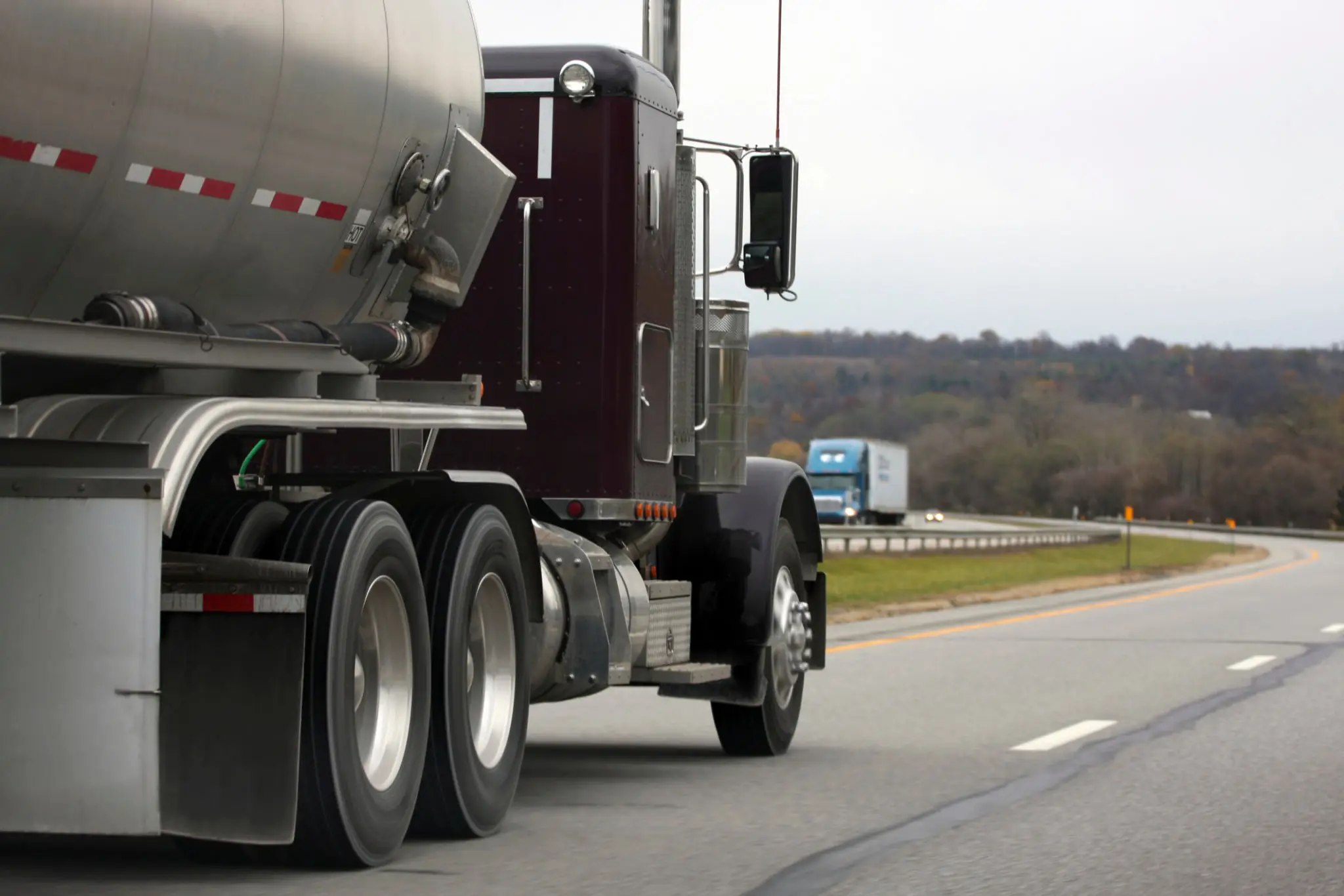 A B&L Middlemen semi-tanker truck driving on a highway.